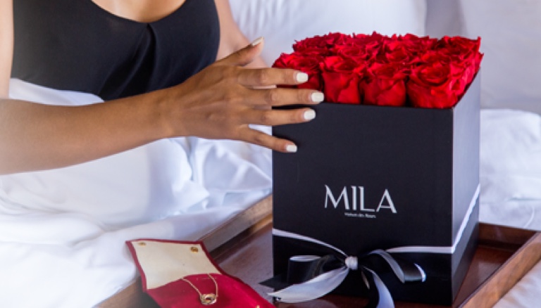 Mila-girl-in-bed-with-roses